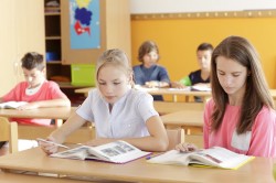 Children are sitting in the classroom